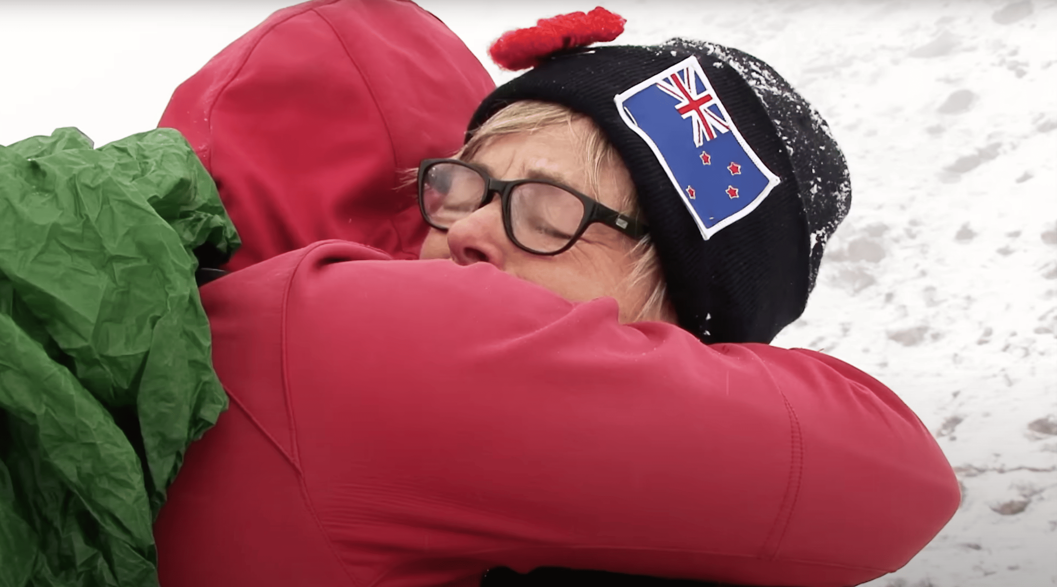 Traveller embracing a member of the response team